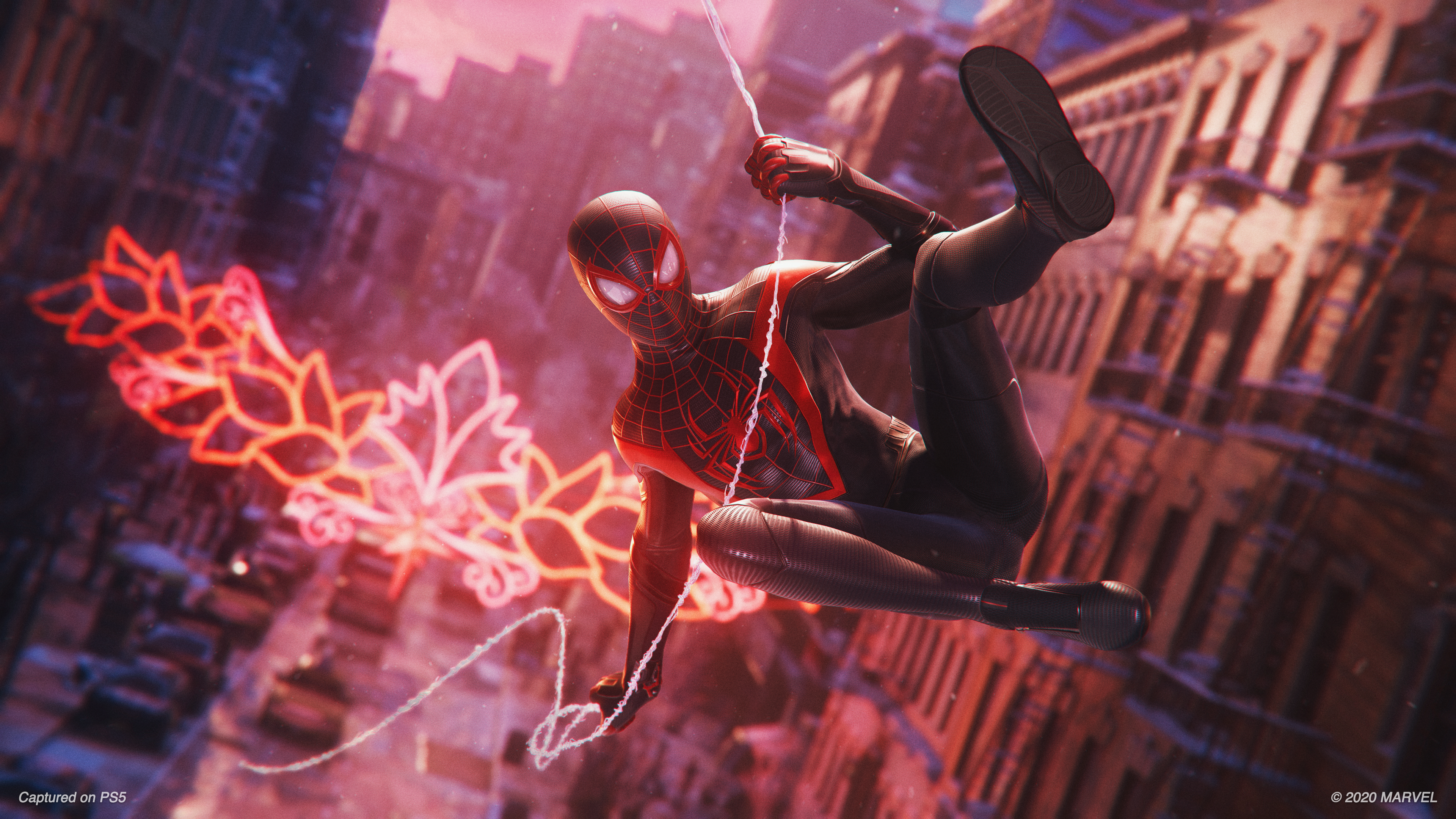 Spider-Man swinging from a web